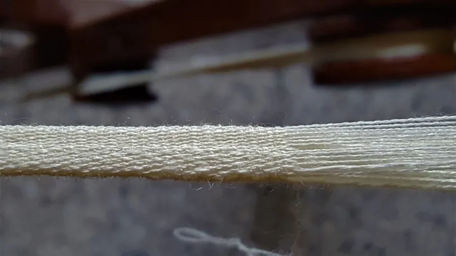 Close-up of a woven Parsi Kusti