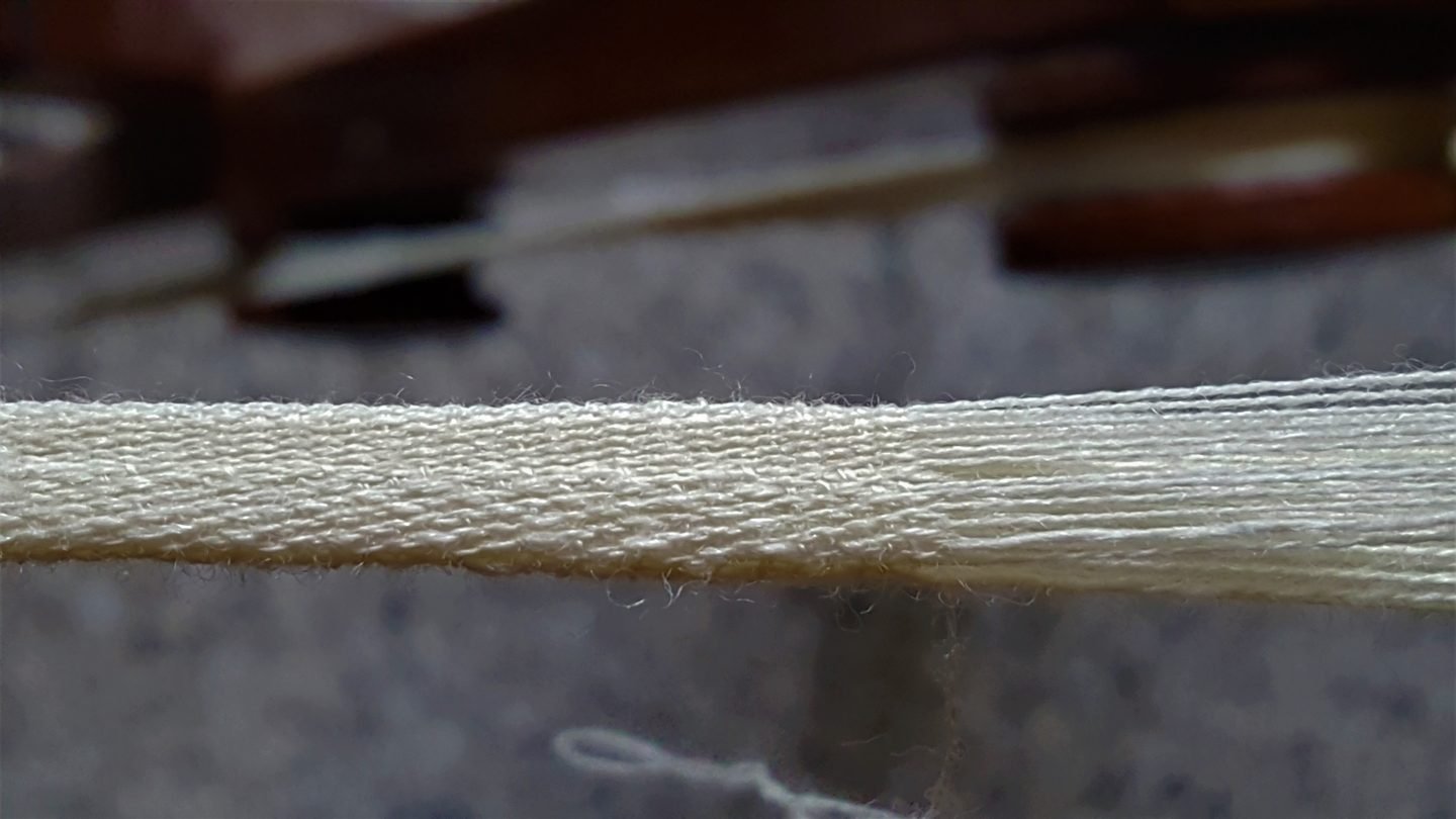 Close-up of a woven Parsi Kasti