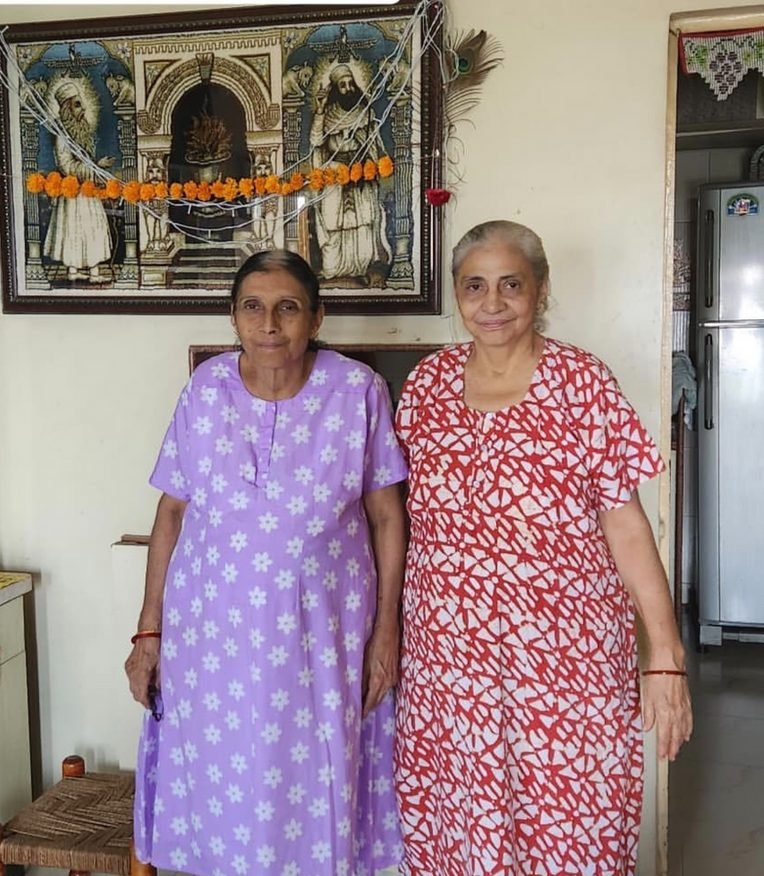 Coomie and Roshni, the weavers of PalV's Kasti, standing together at home