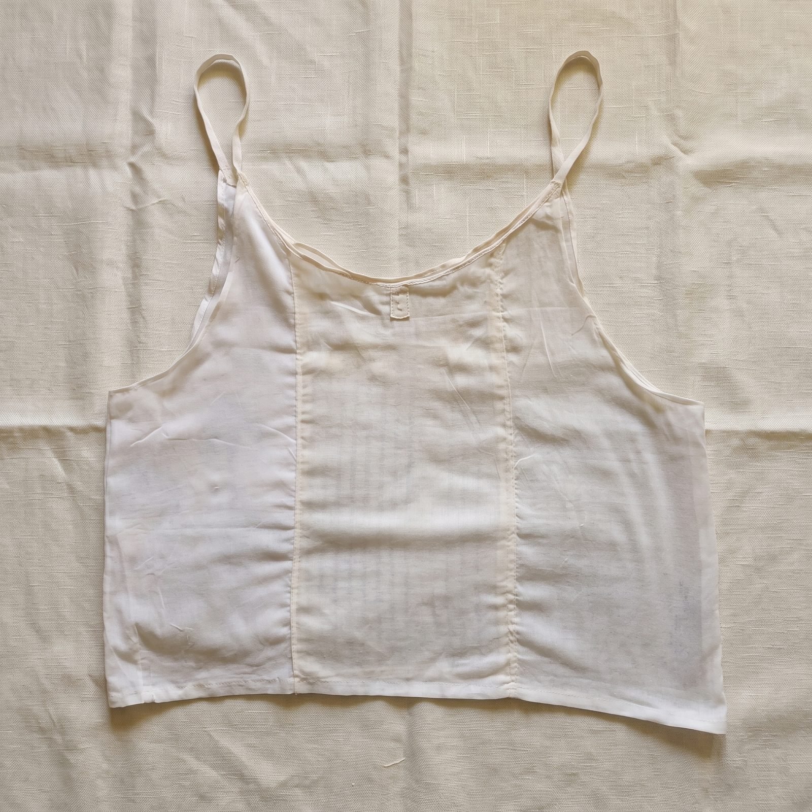 A ladies Parsi Sadra with thin straps laid flat